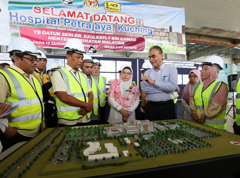 Health Minister Datuk Seri Dzulkefly Ahmad looks at a scaled down model of the completed Petra Jaya Hospital during his visit to the construction site in Kuching, January 12, 2024. — Bernama pic 