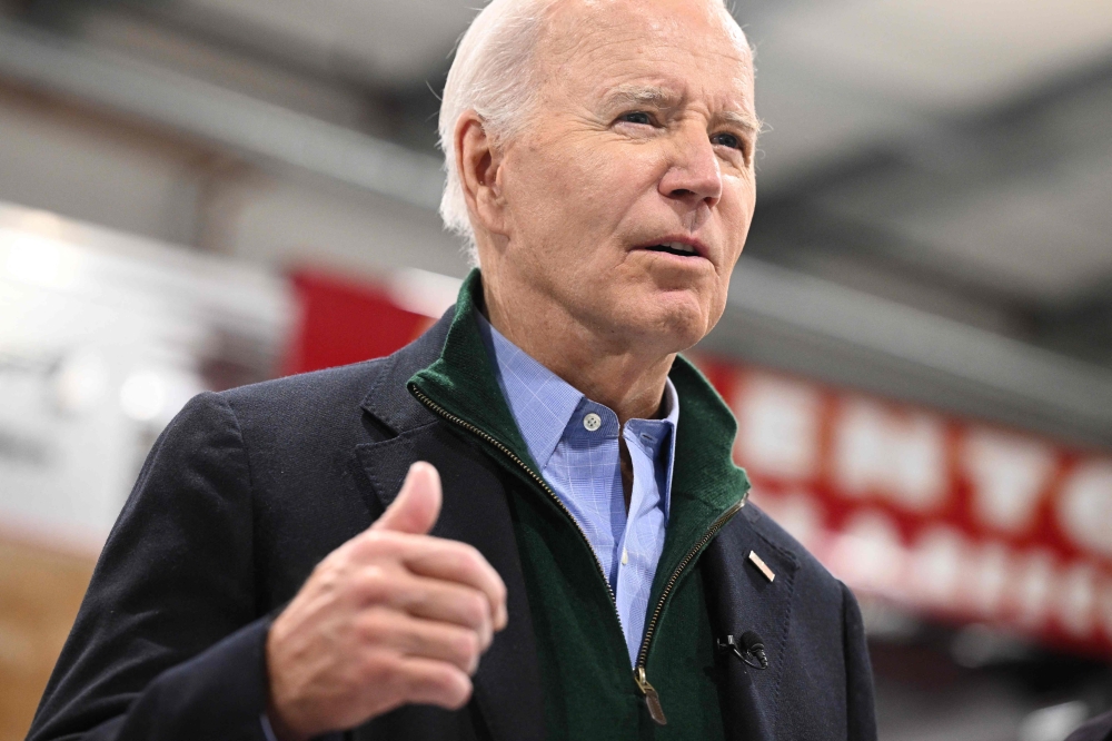 US President Joe Biden speaks to the press during a visit to the Fire Training Academy in Allentown, Pennsylvania  January 12, 2024. — AFP pic