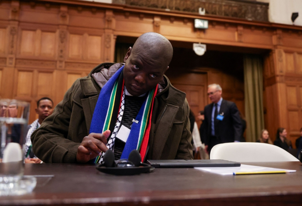 South Africa's Minister of Justice Ronald Lamola sits in the International Court of Justice (ICJ) as judges hear a request for emergency measures by South Africa to order Israel to stop its military actions in Gaza, in The Hague, Netherlands January 12, 2024. — Reuters pic