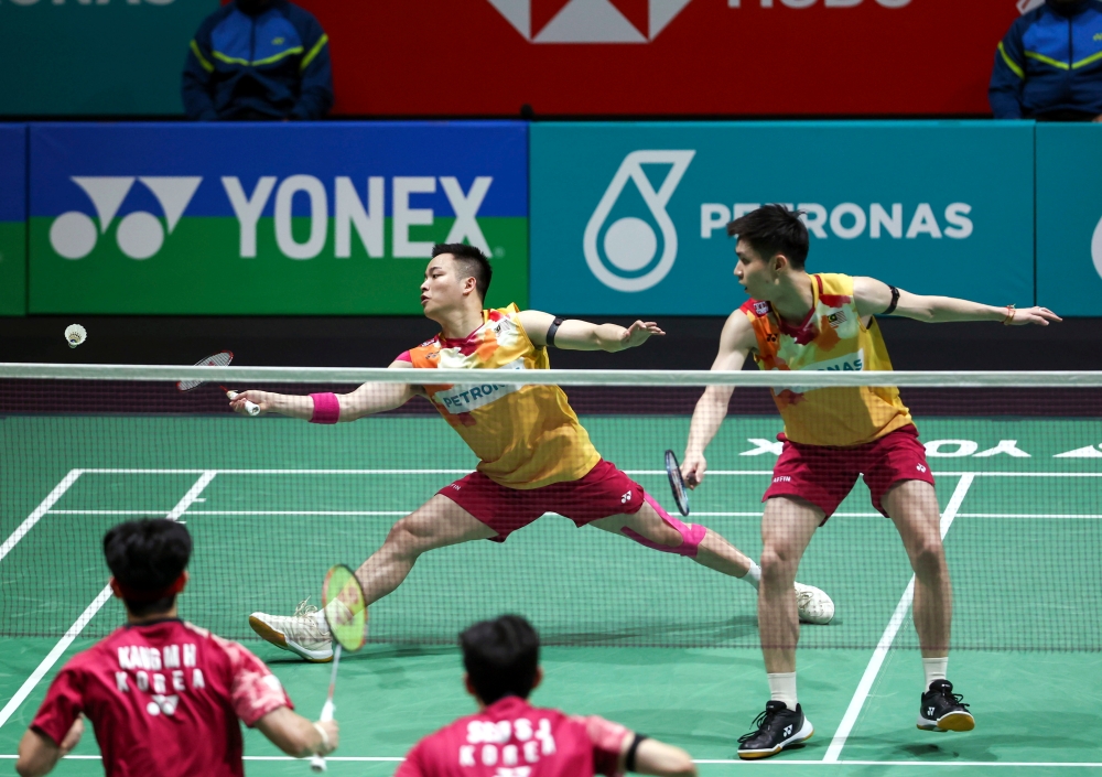 Aaron Chia and Soh Wooi Yik in action during the Malaysia Open badminton match against South Korea’s Kang Min-hyuk and Seo Seung-jae at Arena Bukit Jalil in Kuala Lumpur January 12, 2024. — Bernama pic