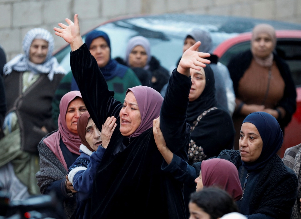 File photo of a woman gesturing as Palestinians attend the funeral of Majdi Fashafshe, a Palestinian gunmen who was shot dead by Israeli security forces during a raid in Jenin in the Occupied West Bank January 11, 2024. — Reuters pic