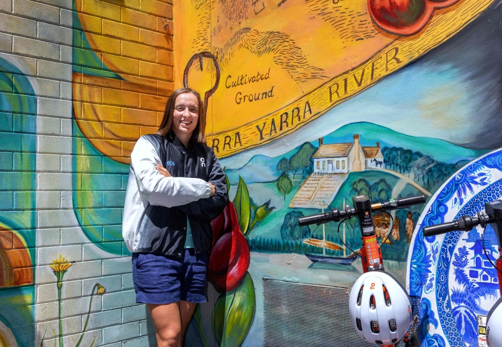 This photo taken on January 12, 2024 and released by Tennis Australia on January 13, 2024, shows Poland’s Iga Swiatek standing next to artwork in Flinders Lane during a promotional event for the 2024 Australian Open starting on January 14. — AFP pic