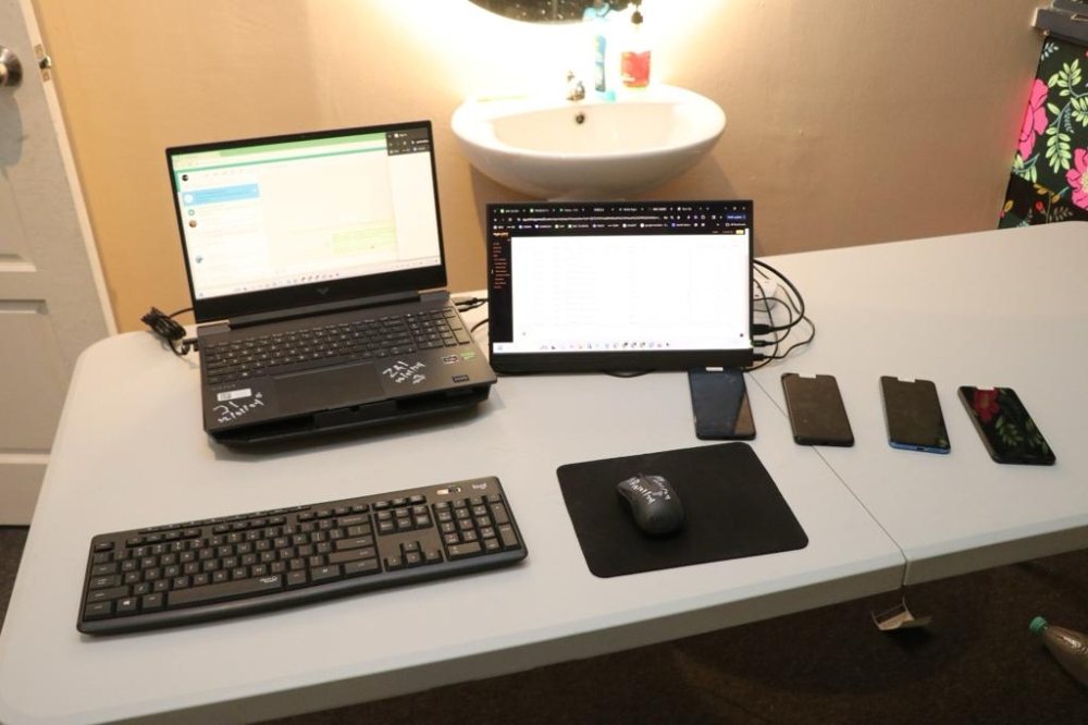 Police photo showing the seized laptop and gadgets used by the suspect. — Picture courtesy of PDRM
