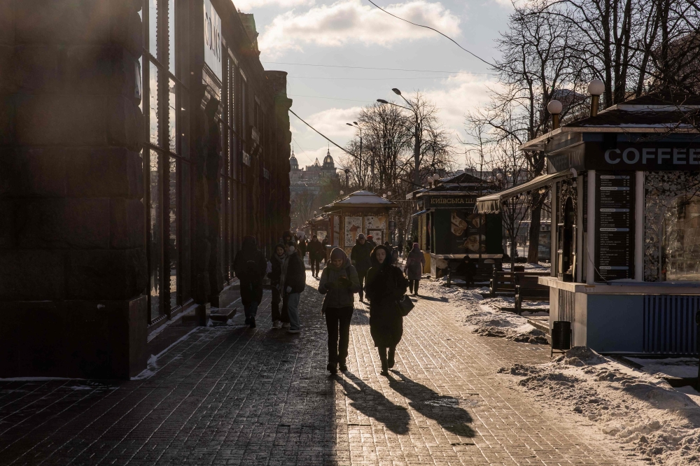 People walk along a street during on sunny day in downtown Kyiv, on January 12, 2024, amid the Russian invasion of Ukraine. — AFP pic