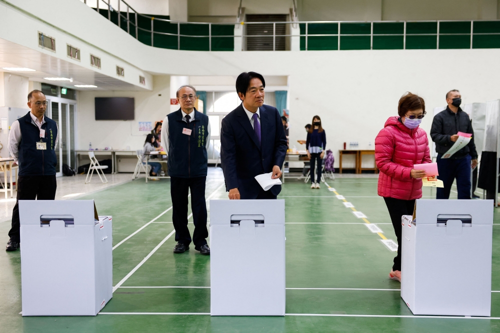 Lai Ching-te, Taiwan’s vice president and the ruling Democratic Progressive Party’s presidential candidate, casts his vote at a polling station during the presidential and parliamentary elections in Tainan, Taiwan January 13, 2024. — Reuters pic