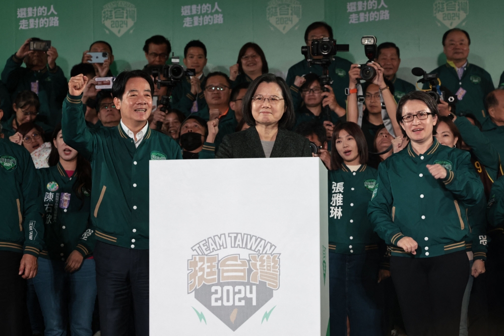 Taiwan’s President Tsai Ing-wen (centre), President-elect Lai Ching-te (left) and his running mate Hsiao Bi-khim attend a rally outside the headquarters of the Democratic Progressive Party (DPP) in Taipei on January 13, 2024, after winning the presidential election. — AFP pic