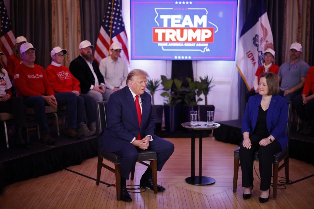 Republican presidential candidate, former US President Donald Trump and Iowa Attorney General Brenna Bird participate in a ‘telerally’ at the Hotel Fort Des Moines on January 13, 2024 in Des Moines, Iowa. Sub-zero temperatures and blizzard-like weather has forced presidential campaigns to adjust, postpone or cancel events just days before the Iowa caucuses, the first primary competition of the 2024 election year. — Getty Images via AFP