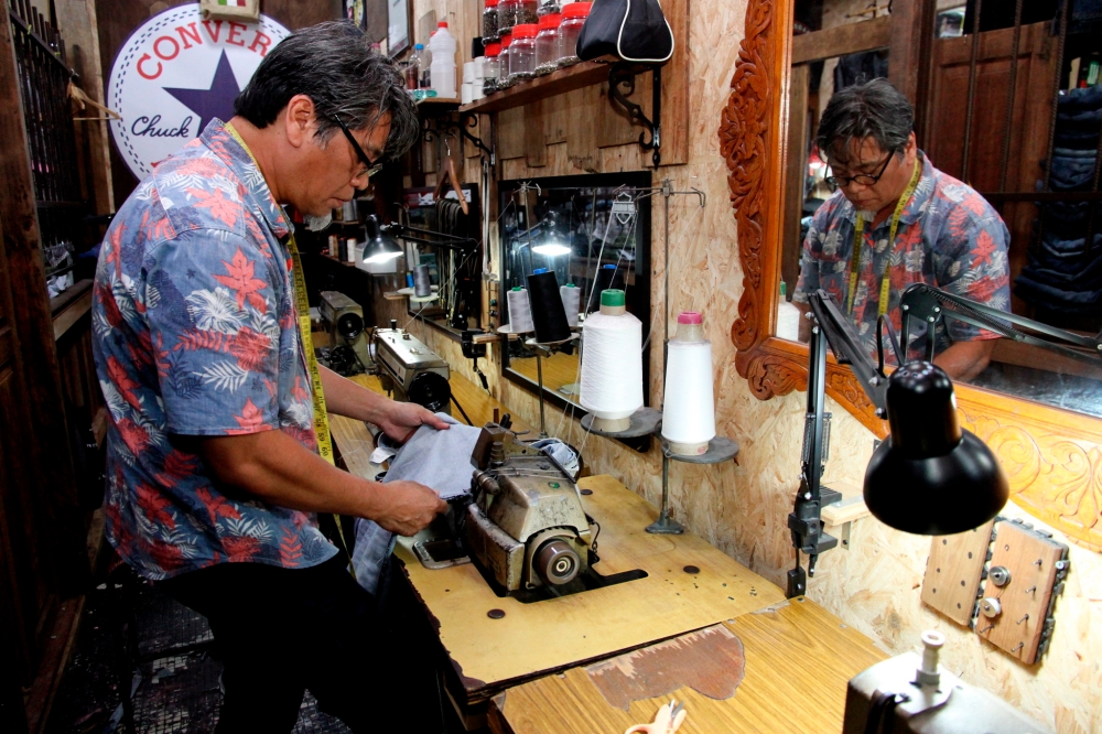 Mohd Shukri Amal, 56, the creative mind behind Amarru Jeans Repair. — Bernama pic