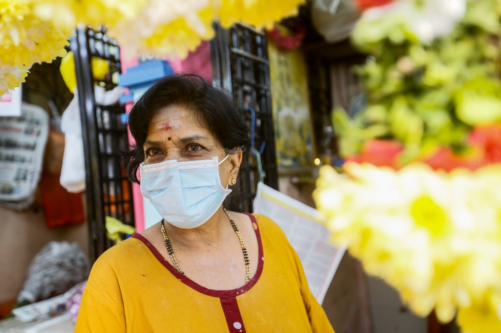 Saraswathy is expecting a busy weekend as most Hindus will throng Brickfields to buy fresh flowers and garlands for Pongal. — Picture by Hari Anggara