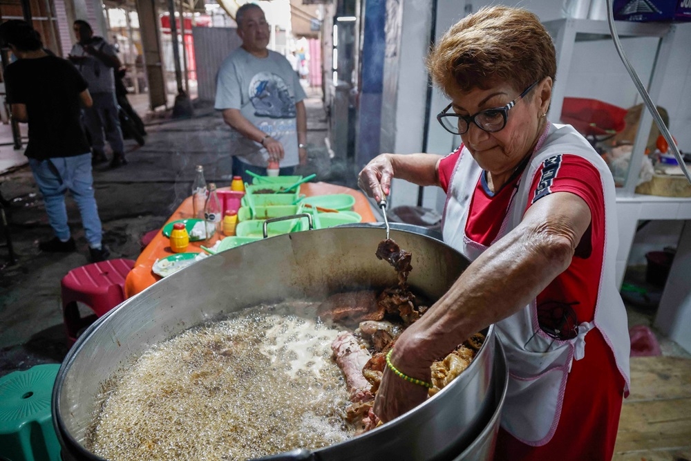 Maria del Pilar Cortes (right) works in her taqueria named ‘Las Corazonas’ at the Tepito neighbourhood, one of the most dangerous neighbourhoods in Mexico City. — AFP pic 