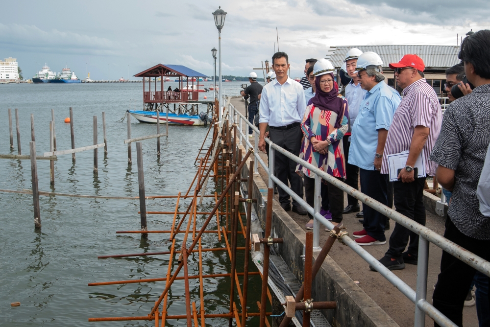 Minister in the Prime Minister’s Department (Federal Territories) Dr Zaliha Mustafa (2nd left) is seen during a working visit to the project to upgrade the bridge at Kampung Patau-Patau 1 January 14, 2024. — Bernama pic