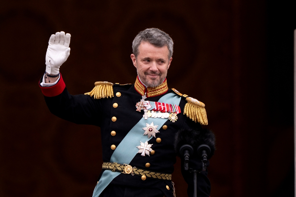 Danish King Frederik X waves to the crowd after a declaration of his accession to the throne by the Danish prime minister, on the balcony of Christiansborg Palace in Copenhagen, Denmark on January 14, 2024. — AFP pic