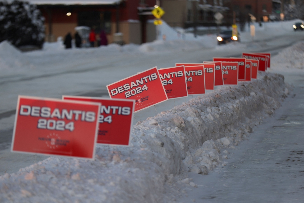Campaign signs are lined up on a sidewalk, outside a campaign event for Florida Governor and Republican presidential candidate Ron DeSantis, ahead of the Iowa caucus vote in Cedar Rapids, Iowa January 14, 2024— Reuters pic