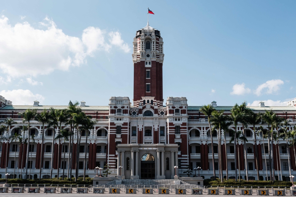 The Taiwanese flag waves on the tower of the Presidential Office Building. — AFP pic