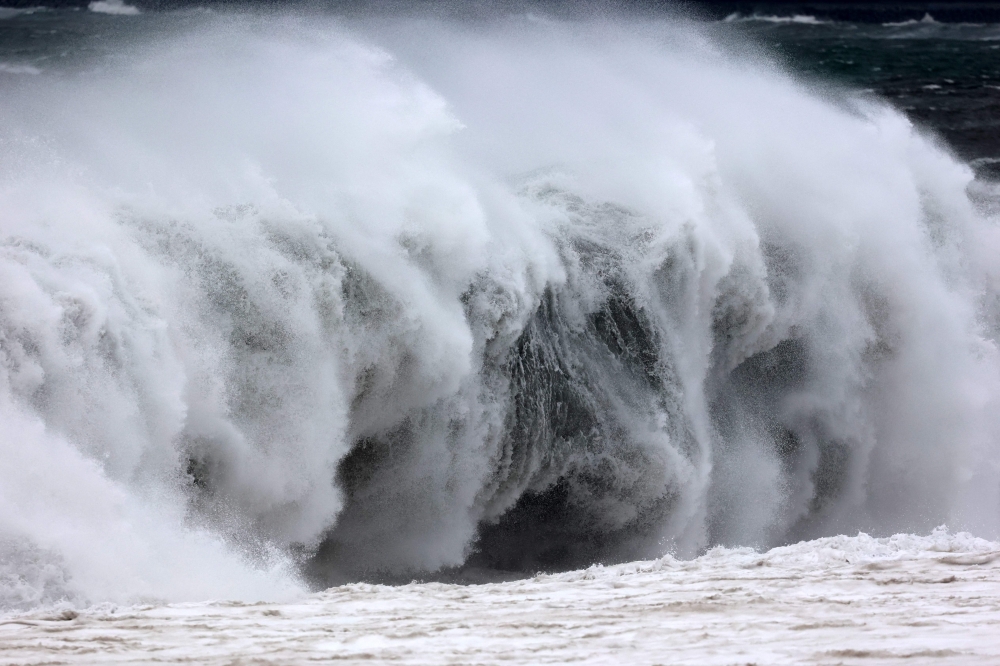 Waves crash on January 14, 2024 in La Possession shore as authorities on France's Indian Ocean Reunion Island urged residents to stock up on food and water ahead of a tropical storm that risks strengthening to a cyclone before it hits later tonight. — AFP pic