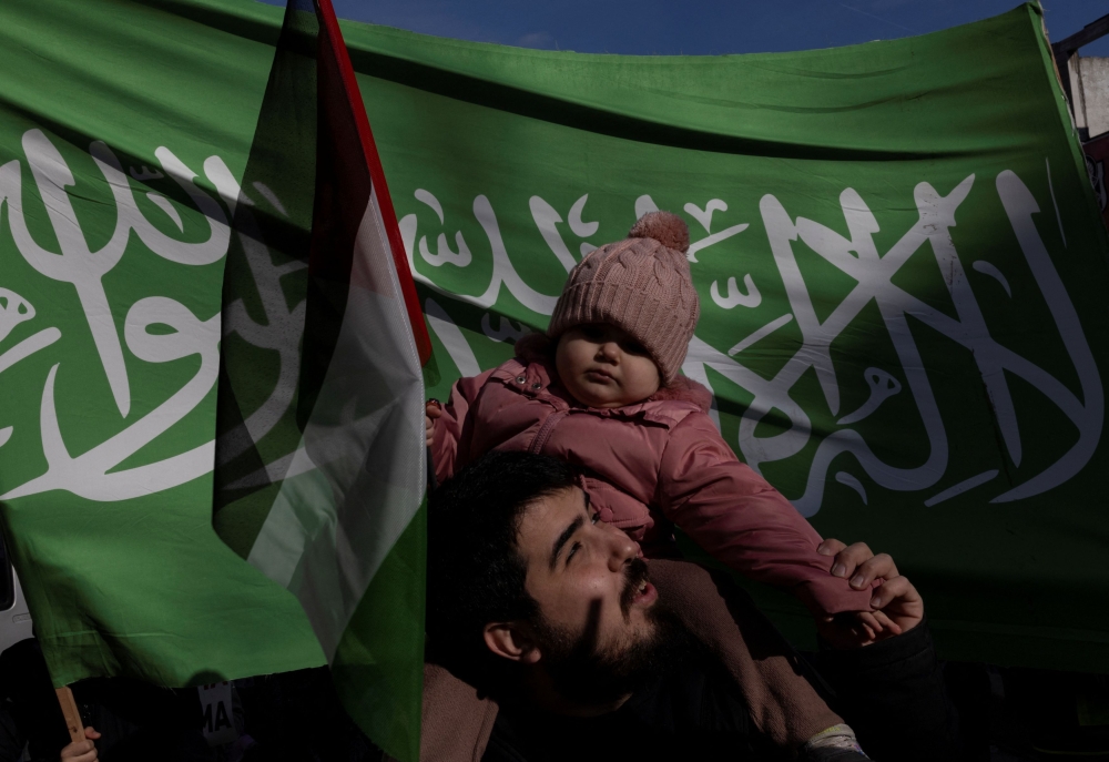 People take part in a demonstration in solidarity with Palestinians in the Gaza Strip, amid the ongoing conflict between Israel and the Palestinian Islamist group Hamas, in Istanbul, Turkey January 14, 2024. — Reuters pic