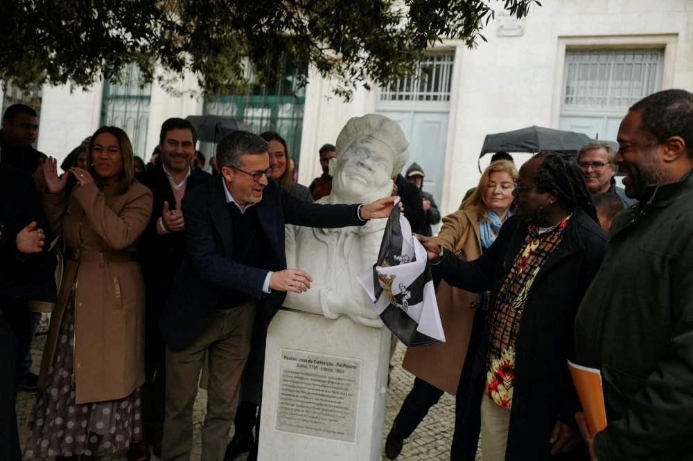 Lisbon mayor, Carlos Moedas attends the unveiling of a statue of Paulino Jose da Conceicao, to celebrate Portugal's African history and the contribution of African descent in Portuguese society in Lisbon, Portugal, January 13, 2024. — Reuters pic