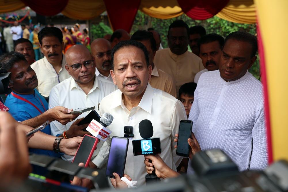 MIC President Tan Sri S A Vigneswaran being met by the media after attending the Ponggal festival held at the MIC Building in Kuala Lumpur, January 15, 2024. — Bernama pic