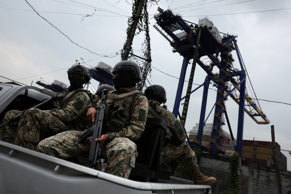 Ecuadorean armed forces members patrol at a commercial harbour area, amid the ongoing wave of violence around the nation, in Guayaquil, Ecuador January 15, 2024. ― Reuters pic