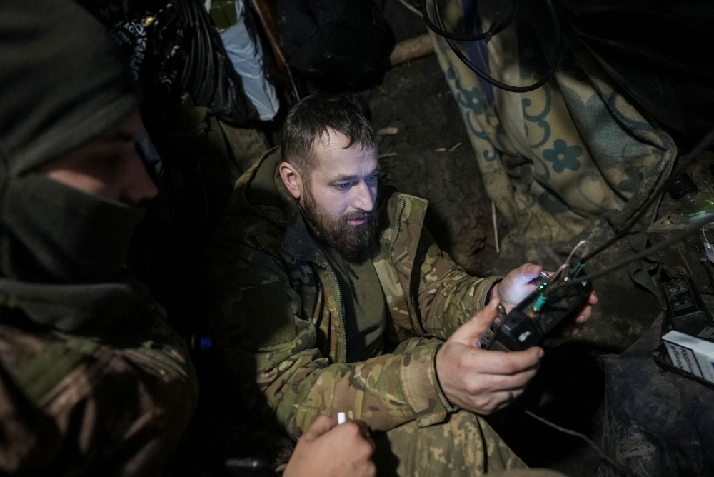 A Ukrainian serviceman of 2 battalion 92nd brigade operates a drone from his positions at a front line, as Russia's attack on Ukraine continues, near the town of Bakhmut in Donetsk region, Ukraine January 13, 2024. ― Reuters pic