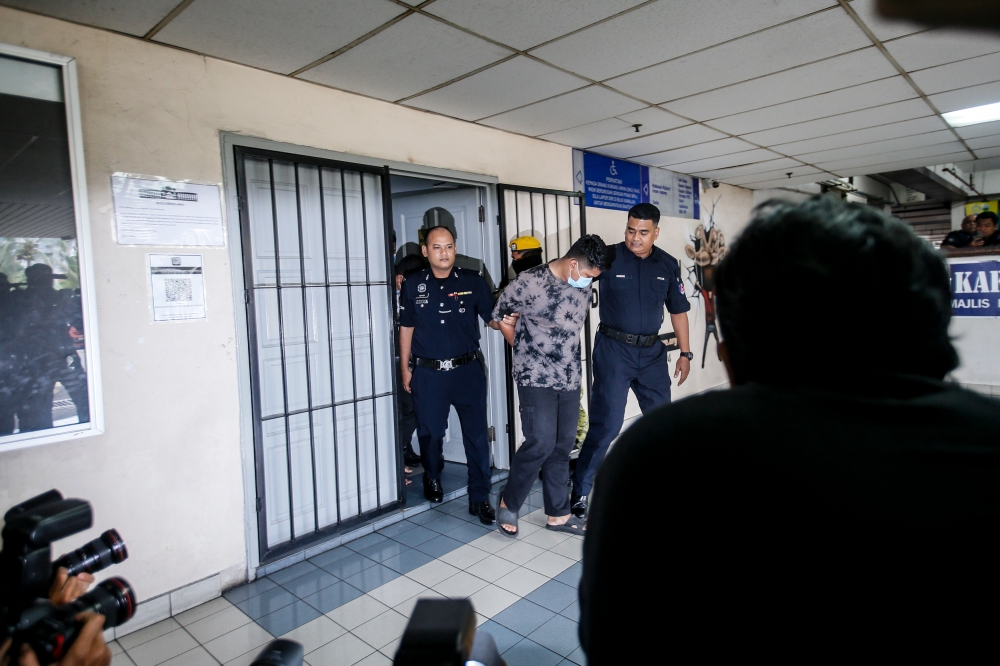 Muhammad Fazrul Razzi Yunus, 31, faces charges of rape, engaging in unnatural intercourse, having sexual relations, and physical sexual assault of a 17-year-old girl inside a police patrol car on the side of Persiaran Saujana Ampang road at 10.30pm on January 9. — Picture by Hari Anggara