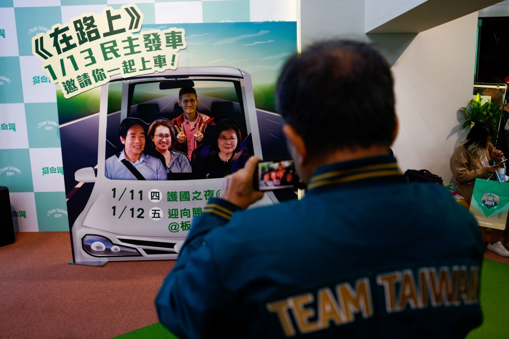 A supporter of the Democratic Progressive Party (DPP) poses for a picture during a rally, following the victory of Lai Ching-te in the presidential elections, in Taipei, Taiwan January 13, 2024. — Reuters pic