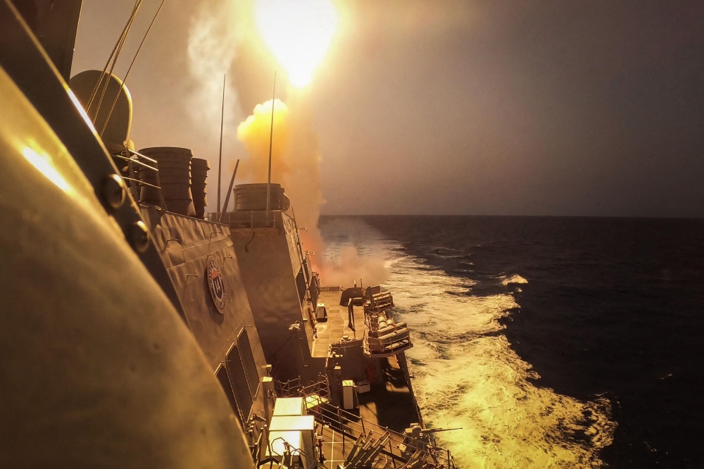 This handout picture courtesy of the US Navy taken on October 19, 2023 shows the Arleigh Burke-class guided-missile destroyer USS Carney (DDG 64) defeating a combination of Houthi missiles and unmanned aerial vehicles in the Red Sea. — AFP  / US Navy/Mass Communication Specialist 2nd Class Aaron Lau pic