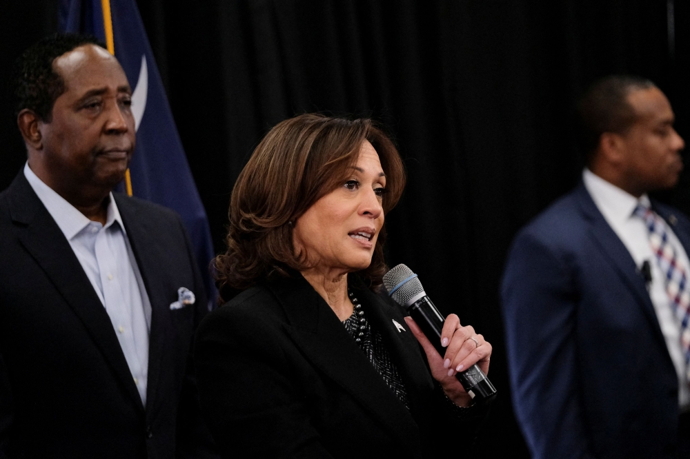 US Vice President Kamala Harris speaks next to State Senator Darrell Jackson (D) as she visits Big T's BBQ in Columbia, South Carolina January 15, 2024. — Reuters pic