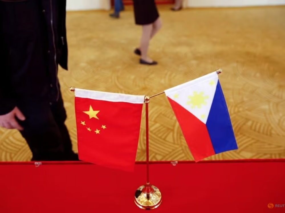 National flags are placed outside a room where Philippine Finance Secretary Carlos Dominguez and China's Commerce Minister Gao Hucheng address reporters after their meeting in Beijing, China, January 23, 2017. — Reuters file pic