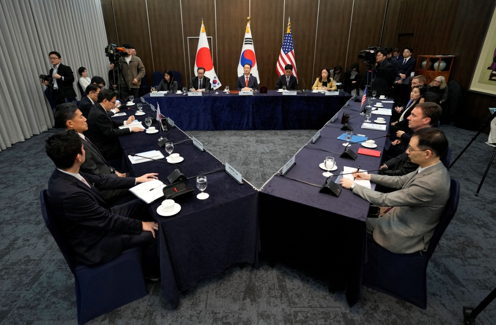 The delegation of South Korea, Japan and the US attend their trilateral meeting at the Foreign Ministry in Seoul, South Korea January 18, 2024. — Reuters pool pic