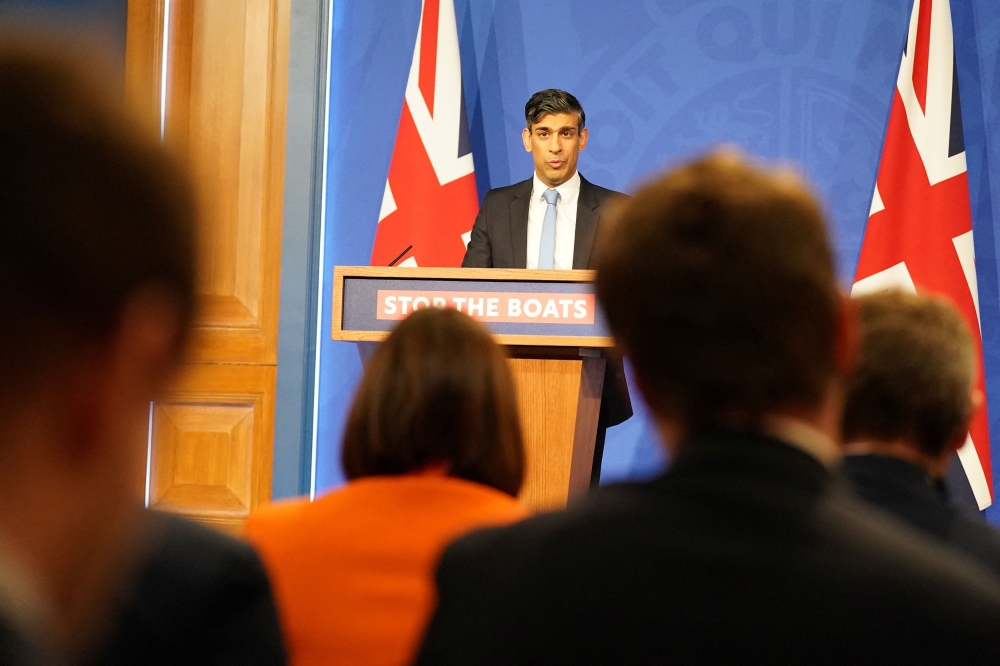 At a press conference when Rishi Sunak tried to convince the public his Conservatives were 'united' around his plans to tackle illegal immigration, he appealed to the House of Lords to help him start the flights before this year’s election. — Reuters pic