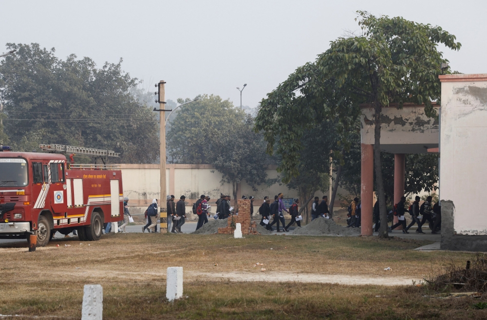 Skilled workers walk to a building for their skill test at a Haryana state government recruitment drive to send workers to Israel, at Maharshi Dayanand University in Rohtak, India, January 17, 2024. — Reuters pic