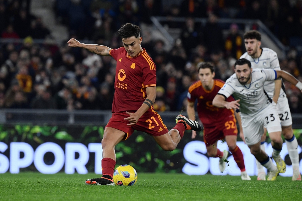Roma’s Argentine forward #21 Paulo Dybala kicks a penalty to score Roma’s first goal during the Italian Serie A football match between AS Roma and Atalanta BC at the Olympic Stadium, in Rome, on January 7, 2024. — AFP pic