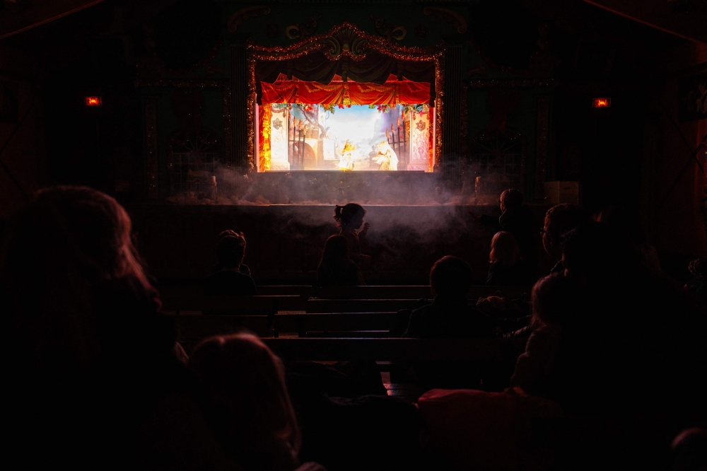 Children and their parents watch an adaptation of ‘Beauty and the Beast’ in the small ‘Marionnettes du champ de Mars’ Guignol theatre, near the Eiffel Tower in Paris January 17, 2024. — AFP pic 