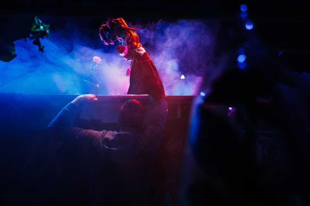 Julien Sommer performs with his puppets an adaptation of ‘Beauty and the Beast’ in the small ‘Marionnettes du champ de Mars’ Guignol theatre, near the Eiffel Tower in Paris January 17, 2024. — AFP pic