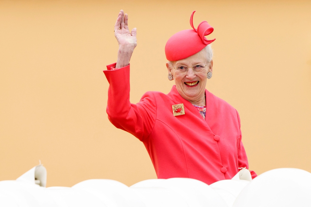 Queen Margrethe II of Denmark waves as she arrives aboard the Royal Yacht Dannebrog in Aarhus Municipality, Denmark on June 3, 2022. — AFP file pic