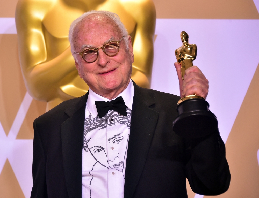 Writer James Ivory poses in the press room with the Oscar for Best Adapted Screenplay for 'Call Me by Your Name', during the 90th Annual Academy Awards on March 4, 2018, in Hollywood, California. — AFP pic