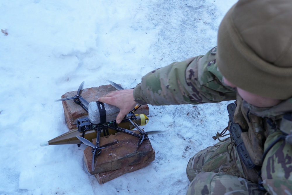 A Ukrainian serviceman of the Rarog UAV squadron of the 24th Separate Mechanized Brigade places a first person view drone with an attached shell for an RPG-7 grenade launcher to a launch point, at a position near the town of Horlivka, amid Russia's attack on Ukraine, in Donetsk region January 17, 2024. Oil tanks at a storage facility in the town of Klintsy in Russia’s Bryansk region caught fire after the military brought down a Ukrainian drone, Alexander Bogomaz, the regional governor, said today. — Reuters pic  
