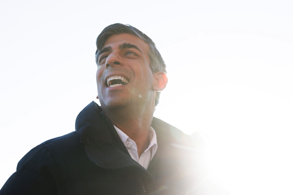 British Prime Minister Rishi Sunak speaks with Eastleigh FC players and staff during a visit at Silverlake Stadium in Eastleigh, Hampshire, Britain, January 19, 2024. — Dan Kitwood/Pool/Reuters pic