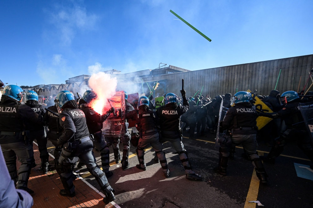 Demonstrators clash with riot police during a protest against the presence of an Israeli pavillion at Vicenzaoro, the largest show in Europe for the gold and jewellery industry, at Fiera Vicenza in Vicenza, on January 20, 2024. — AFP pic