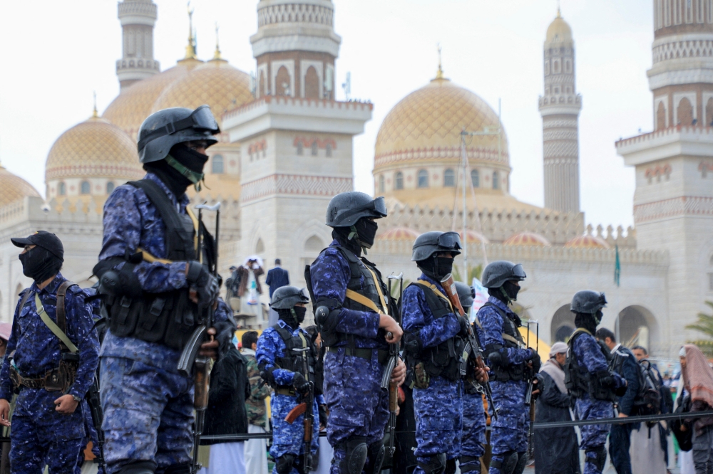 Members of Houthi security forces stand guard during an anti-Israel and anti-US rally in the Houthi-controlled capital Sanaa on January 19, 2024, protesting the US designation of Yemen’s Houthi rebels as ‘terrorists’, after a series of attacks on Red Sea shipping amid ongoing battles between Israel and the militant Hamas group in Gaza. — AFP pic
