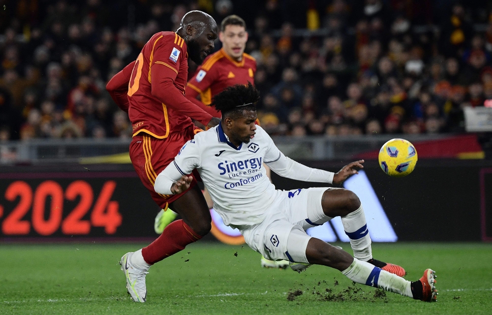 Roma Belgian forward Romelu Lukaku fights for the ball against Colombian defender Juan David Cabal during the Italian Serie A football match between AS Roma and Hella Verona FC at the Olympic stadium in Rome on January 20, 2024. — AFP pic 