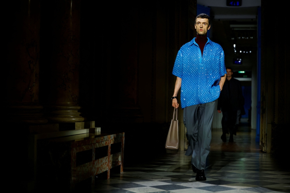 A touch of extravagance came from a sparkly blue shirt, elaborate cutout patterns on tailored jackets and long thick fringes that embellished a coat. — Reuters pic 