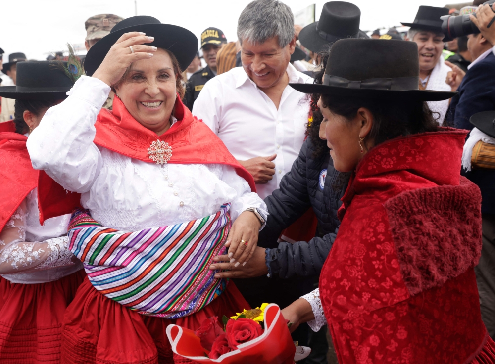 A handout picture released by the Peruvian Presidency shows President Dina Boluarte during the laying of the foundation stone for the asphalting of a road in the Chiara district in the Ayacucho region, some 570 km southeast of Lima, on January 21, 2024. — AFP pic