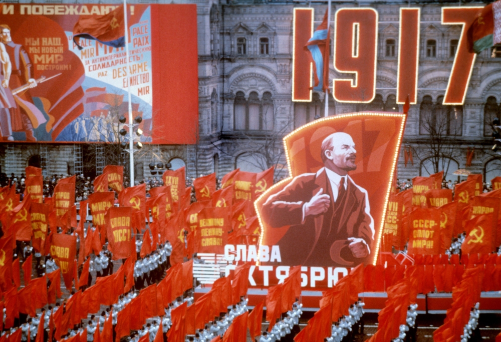 File photo of people taking red flags and portrait of Vladimir Ilyich Lenin during celebration of the 68th anniversary of the Great October Socialist Revolution in the Red Square, Moscow, Russia, on November 7, 1985. — AFP pic