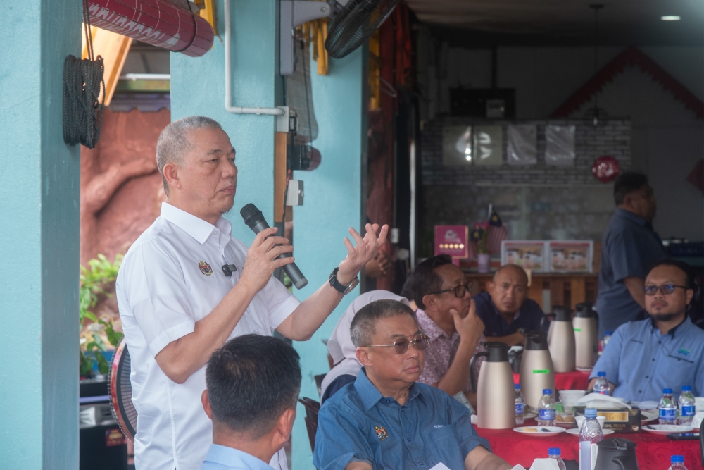 Deputy Prime Minister Datuk Seri Fadillah Yusof delivers a speech during a meet-the-people session in Labuan January 21, 2024. — Bernama pic
