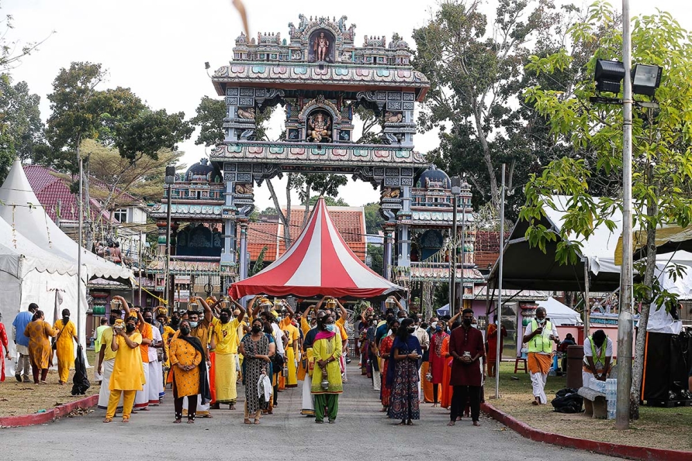 Devotees are seen as they make their way to the Hilltop Murugan Temple during the Thaipusam celebration at Jalan Kebun Bunga in Penang January 18, 2022. — Picture by Sayuti Zainudin 