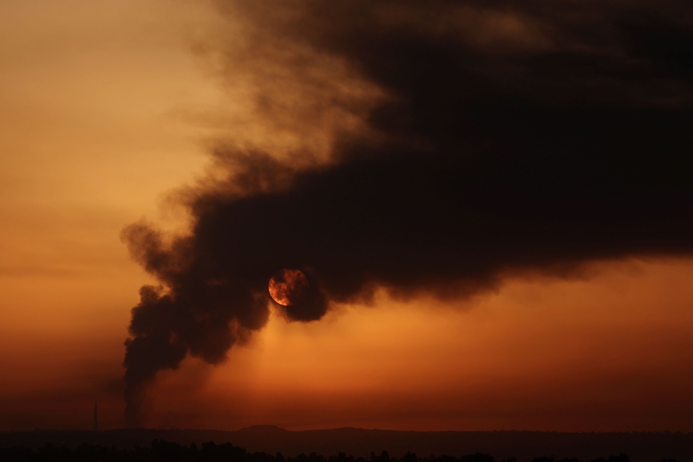 Smoke rises over the Gaza Strip, amid the ongoing conflict between Israel and the Palestinian Islamist group Hamas, as seen from Israel's border with Gaza in southern Israel January 21, 2024. — Reuters pic