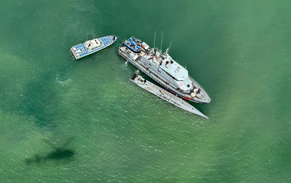 Handout picture released by Ecuador's Armed Forces press office on January 21, 2024, showing the capture of a semi-submersible following a joint operation with the National Police and the Colombian Navy, near Esmeraldas, Ecuador, on Januray 20, 2024. — AFP pic