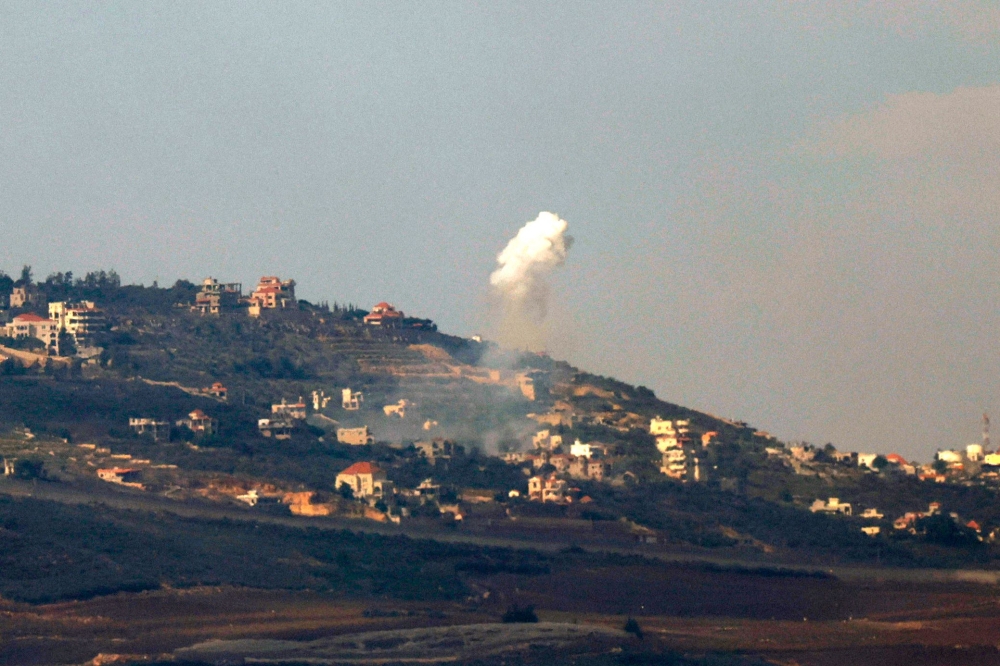 This picture taken from an Israeli position along the border with southern Lebanon shows smoke billowing above the Lebanese village of Odaisseh during Israeli bombardment on January 22, 2024, amid ongoing cross-border tensions as fighting continues between Israel and Hamas militants in Gaza. — AFP pic